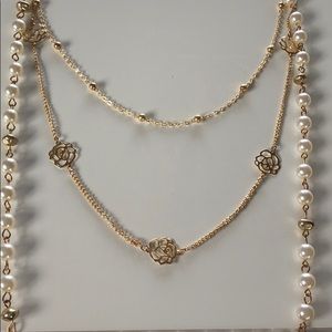 Layered pearl necklace.